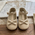 Cream Patent T-Strap Bow Flats